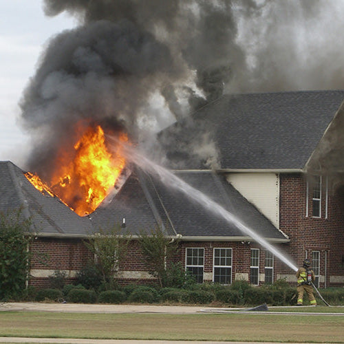 fire fighters putting out home fire