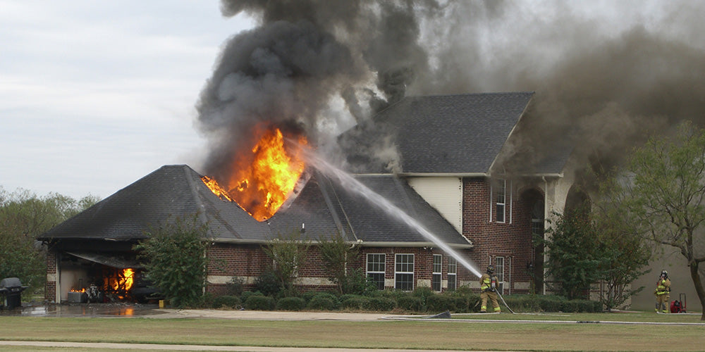 fire fighters putting out home fire